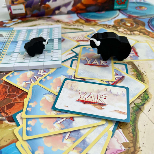 YAK - an economy-building board game by Michael Luu.
